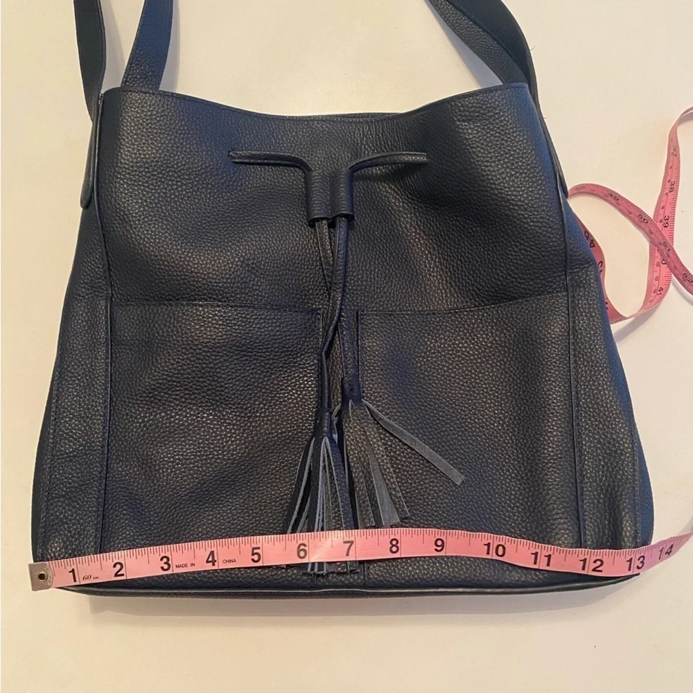 LAGGO || Andrea Tassel Drawstring Hobo Bag Pockets Pebbled Leather Navy‎
